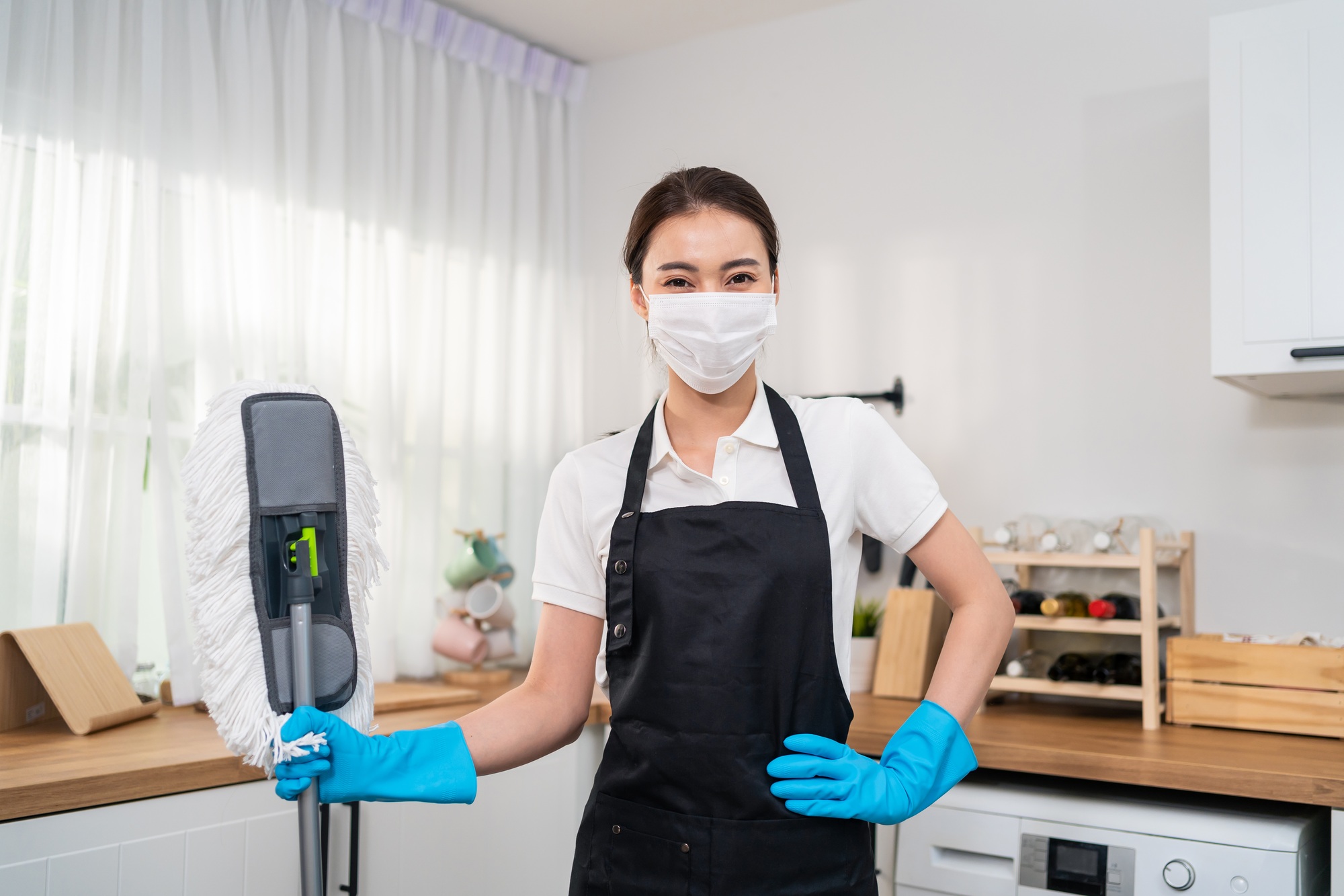 Portrait of Asian young cleaning service woman worker working in house.